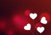 காதல் உணர்வுகள் elegant-hearts-on-red-bokeh-background-vector-19372215