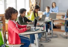 Teachers guiding minds in the digital age modern-elementary-education-concept-group-600nw-2500679775